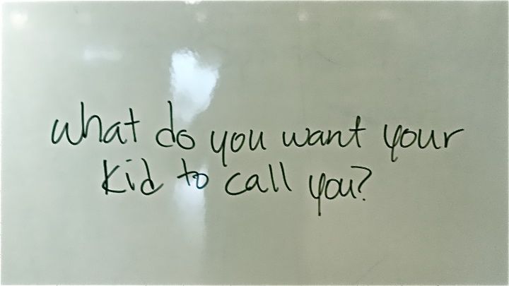 A whiteboard with black printing that says "What do you want to kid to call you?"