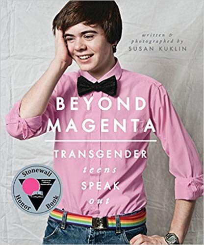 Book Cover - Transmasculine teen holding face and smiling, wearing pink shirt, black bow-tie, green pants, and rainbow belt