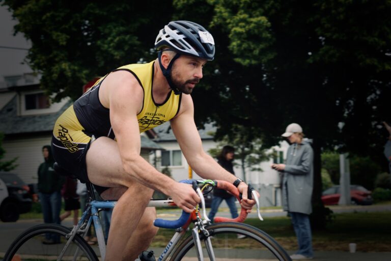 A photo of Kingsley from the side during the cycling portion of the 2025 Triathlon of Compassion.