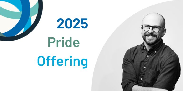 A black and white headshot of Kingsley, who is a white person with short hair and glasses. Kingsley is wearing a dark, button-up shirt and smiling.